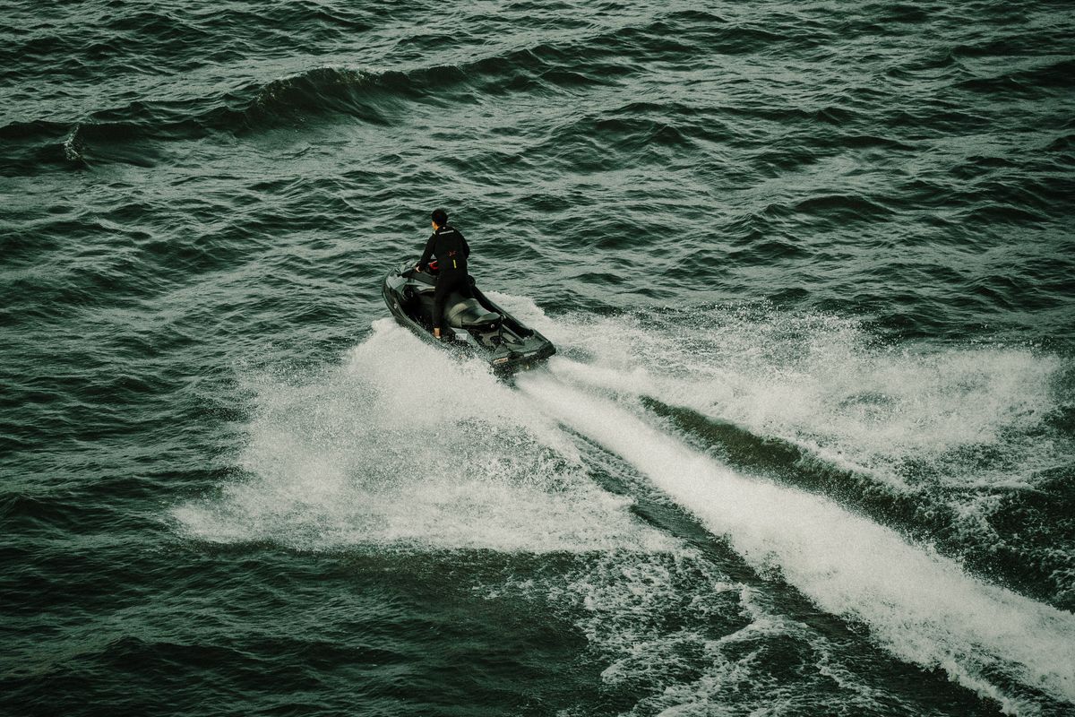 Happy riders giving a thumbs up on a jet ski in Diani